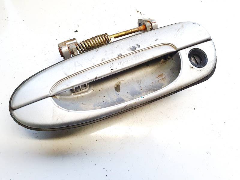 Mazda 626 1998 Etuoven ulkokahva - EDESSÄ VASEMMALLA - Thumbnail 2