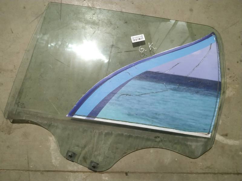 AS2 Dacia Logan 2012 Durvju stikls - AIZMUGURE PA KREISI