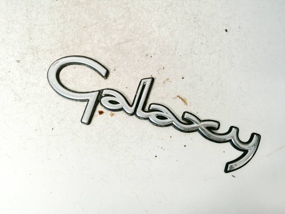 95VWA42528BBW Ford Galaxy 2000 Galinis zenkliukas (Emblema) G.